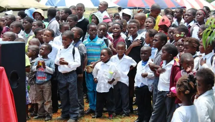 Children gathered at a community event in Soshanguve, faces bright with anticipation